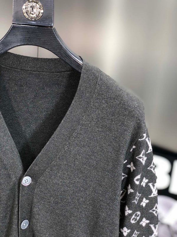 Close-up detail shot of Louis Vuitton luxury clothing with signature branding