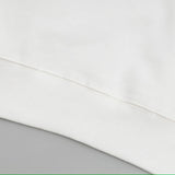 Close-up detail shot of Louis Vuitton luxury clothing with signature branding