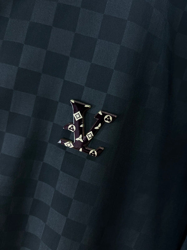 Close-up detail shot of Louis Vuitton luxury clothing with label-forward styling