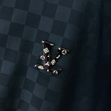 Close-up detail shot of Louis Vuitton luxury clothing with label-forward styling
