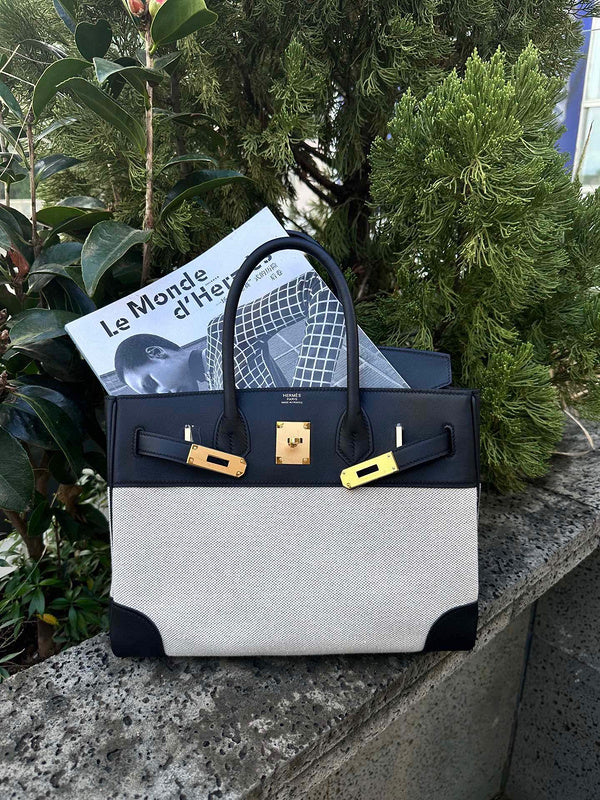 Side view of tailored structured handbag