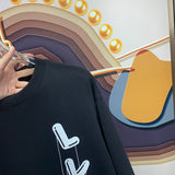 Front view of Louis Vuitton luxury clothing with signature branding