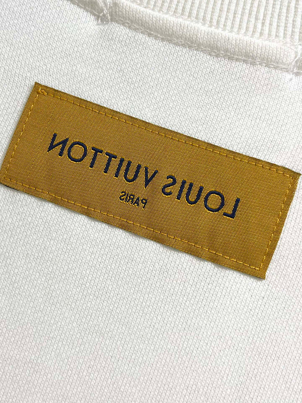 Side profile of Louis Vuitton luxury clothing with tailored silhouette