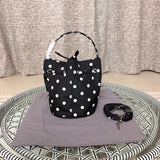 Close-up detail of polished elevated women's handbag – women's luxury accessory