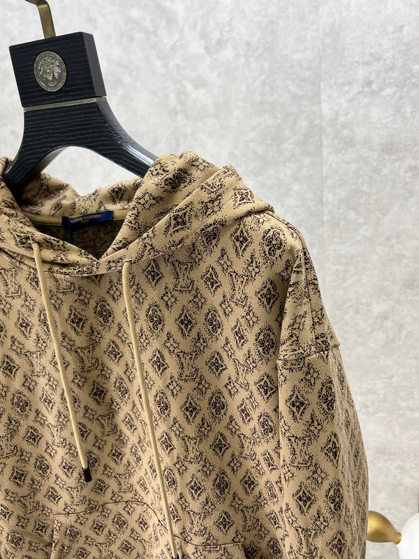 Close-up detail shot of Louis Vuitton luxury clothing with logo-detail design
