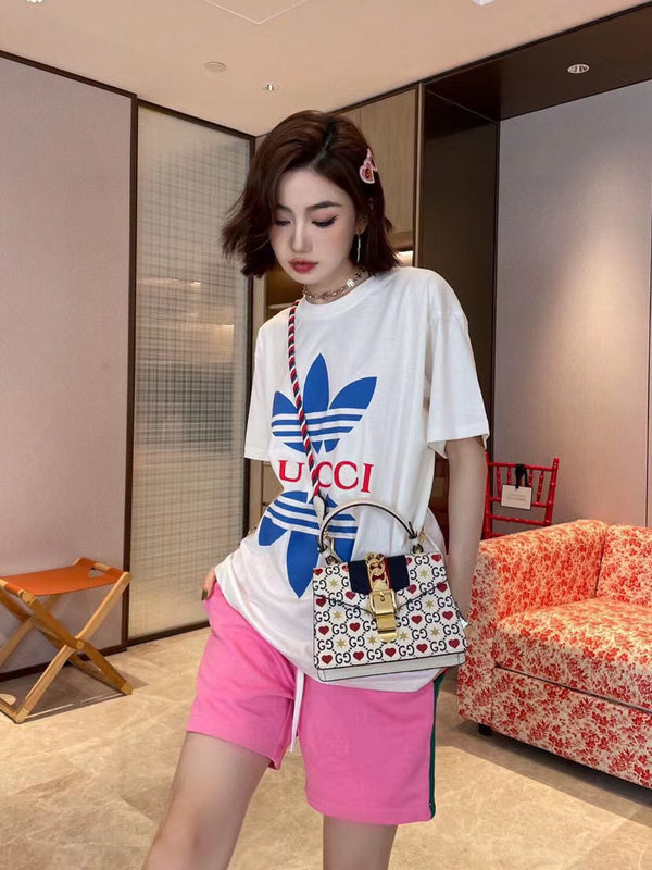 Full styled look of Gucci luxury clothing with signature branding