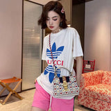 Full styled look of Gucci luxury clothing with signature branding