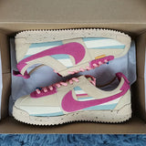 Nike Streetwear sneakers in neutral cream breathable knit upper front view
