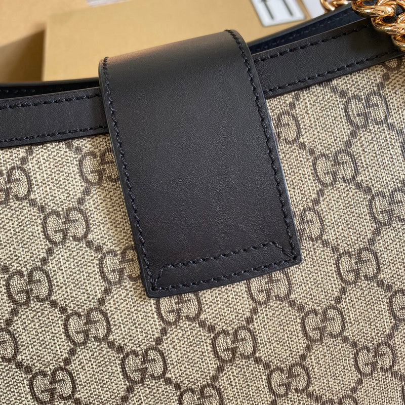 Handle and strap detail of refined elevated women's handbag – women's statement bag