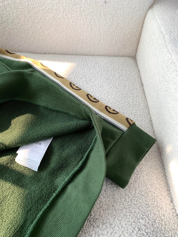 Close-up detail shot of Gucci luxury clothing with logo-detail design
