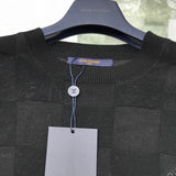 Flat lay presentation of Louis Vuitton luxury clothing with signature branding