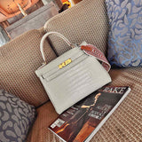 Side view of polished structured handbag