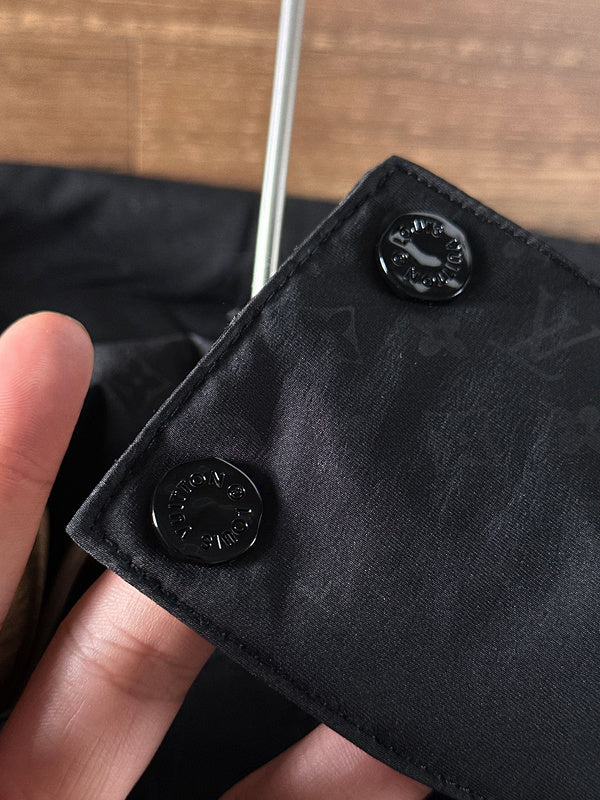 Close-up detail shot of Louis Vuitton luxury clothing with everyday silhouette