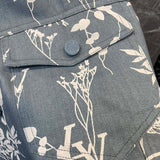 Back view of Louis Vuitton luxury clothing with label-forward styling