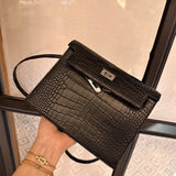 Side view of sleek structured handbag