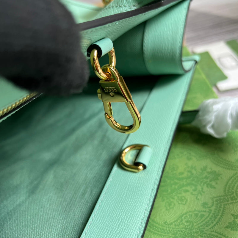 Close-up detail of statement polished women's handbag – women's statement bag