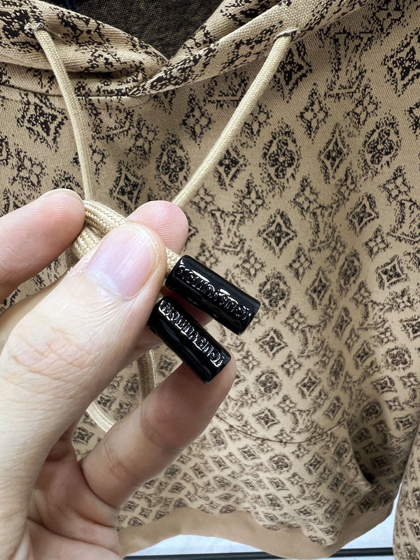 Flat lay presentation of Louis Vuitton luxury clothing with logo-detail design