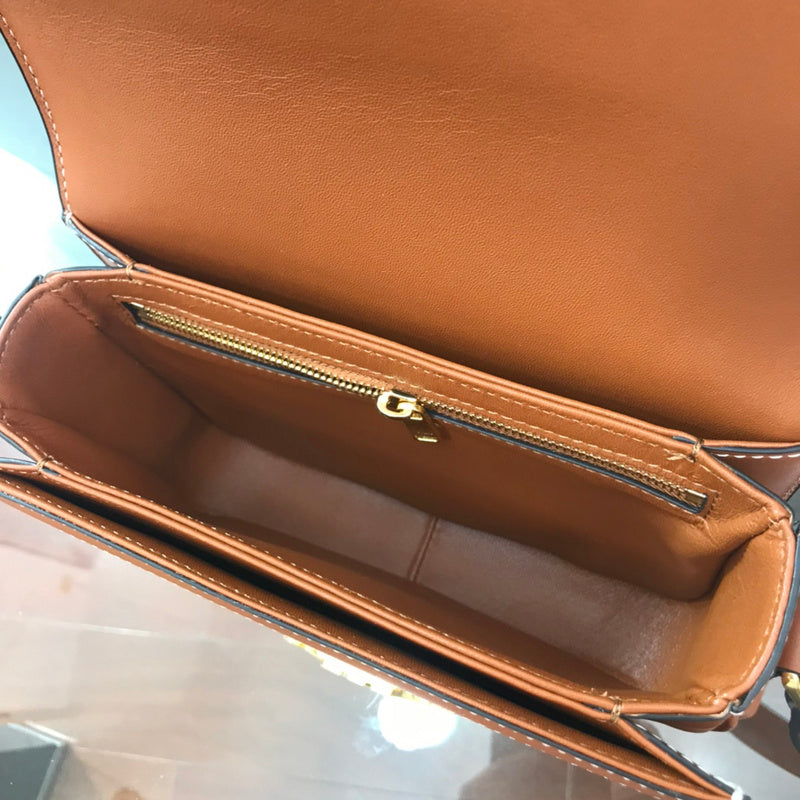 Close-up detail of signature elevated women's handbag – women's designer-style accessory