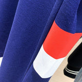 Side profile of Moncler luxury clothing with signature branding