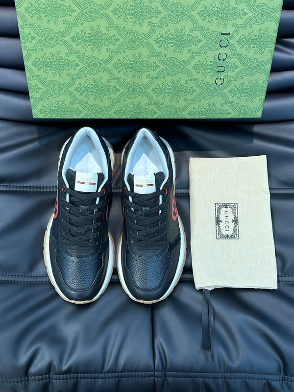 Side profile of Gucci all-black sneakers low-top design