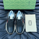 Side profile of Gucci all-black sneakers low-top design