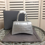 Styled lifestyle shot of premium signature women's handbag – women's statement bag