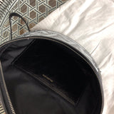 Side profile of structured everyday-luxe women's handbag – women's designer-style accessory