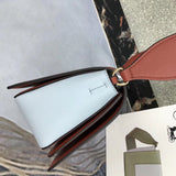 Styled lifestyle shot of refined polished women's handbag – women's premium purse