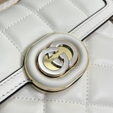 Back view of classic polished women's handbag – women's statement bag