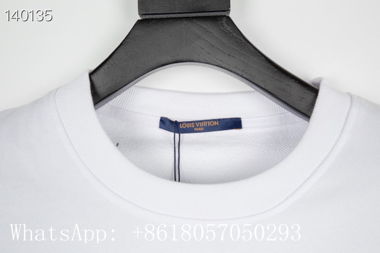 Front view of Louis Vuitton luxury clothing with label-forward styling