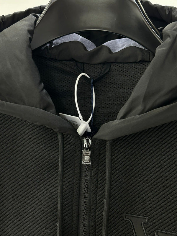 Close-up detail shot of Louis Vuitton luxury clothing with label-forward styling