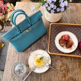  Signature tote bag carried on shoulder