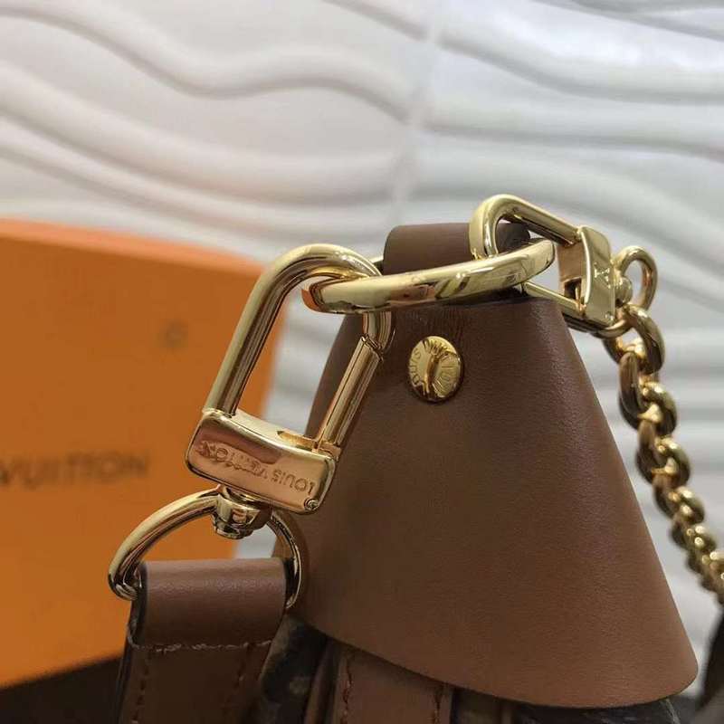 Handle and strap detail of modern signature women's handbag – women's designer-style accessory