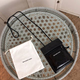 Styled lifestyle shot of elevated signature women's handbag – women's luxury handbag