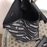 Back view of polished structured women's handbag – women's statement bag