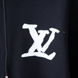 Flat lay presentation of Louis Vuitton luxury clothing with relaxed-fit cut