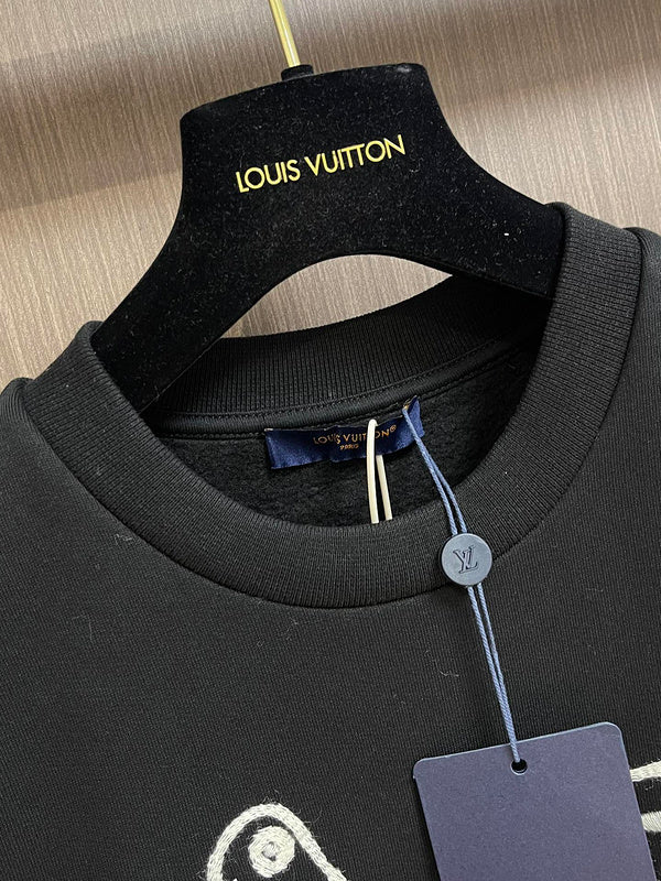 Close-up detail shot of Louis Vuitton luxury clothing with logo-detail design