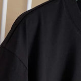 Close-up detail shot of Givenchy luxury clothing with monogram-inspired silhouette