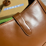 Styled lifestyle shot of polished sleek women's handbag – women's designer-style accessory