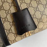Styled lifestyle shot of refined elevated women's handbag – women's statement bag