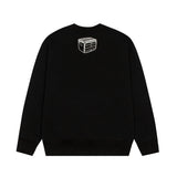 Close-up detail shot of Louis Vuitton luxury clothing with monogram-inspired silhouette