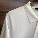 Full styled look of Louis Vuitton luxury clothing with label-forward styling