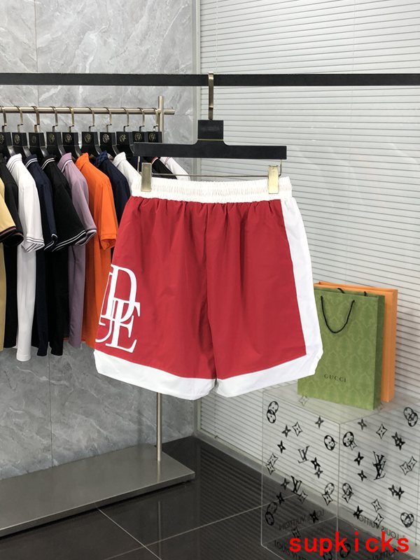 Side profile of Rhude luxury clothing with label-forward styling