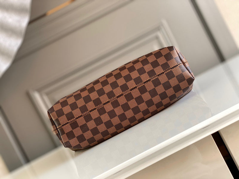 Styled lifestyle shot of signature sleek women's handbag – women's luxury handbag