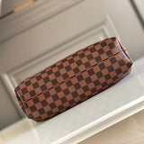 Styled lifestyle shot of signature sleek women's handbag – women's luxury handbag