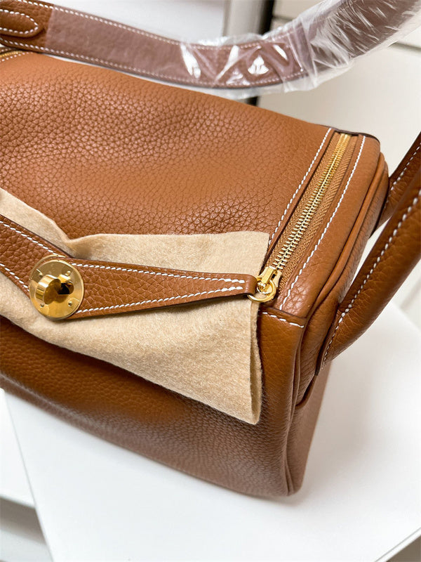 Side view of curated structured handbag