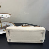 Side view of polished structured handbag