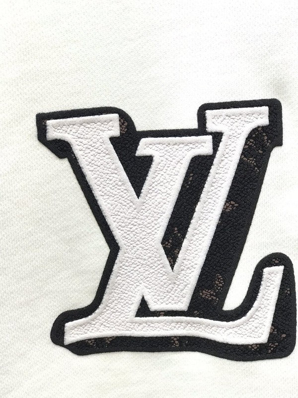 Flat lay presentation of Louis Vuitton luxury clothing with streetwear-inspired cut