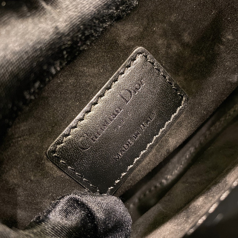 Side profile of elevated modern women's handbag – women's luxury accessory