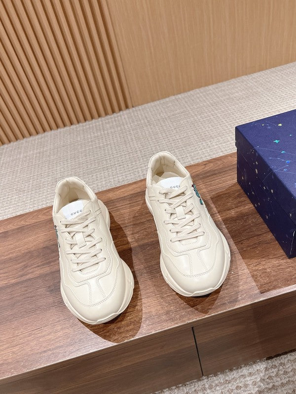 Side profile of Gucci classic monochrome sneakers heritage-inspired look